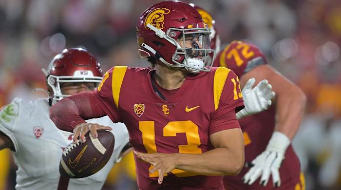 Oct 8, 2022; Los Angeles, California, USA; Pressure from Washington State Cougars linebacker Daiyan Henley (1) forces an incomplete pass by USC Trojans quarterback Caleb Williams (13) in the second half at United Airlines Field at Los Angeles Memorial Coliseum.